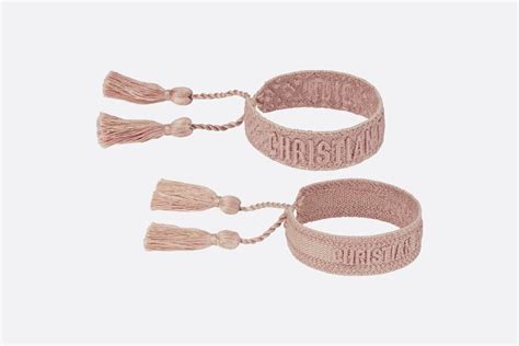 dior strand|Dior pastel pink bracelet.